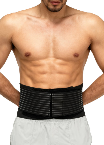 Back brace worn by man for lumbar support, front view