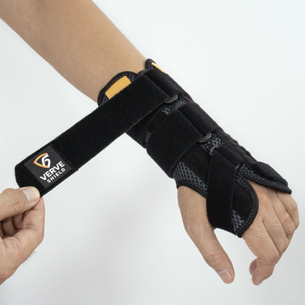 Black wrist support brace on a person's wrist with 'Verve Shield' branding.