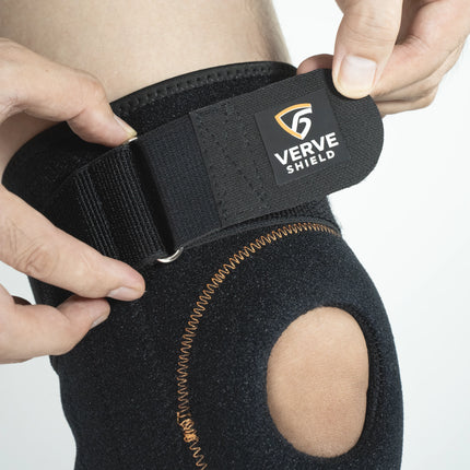 Black knee brace with 'Verve Shield' logo being worn on a person's knee.