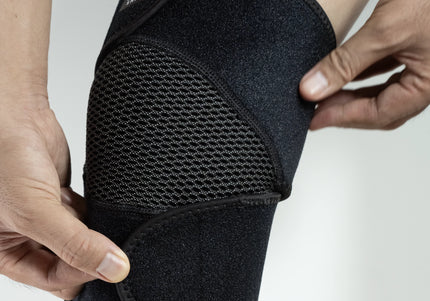 close-up of knee brace with breathable material worn by model