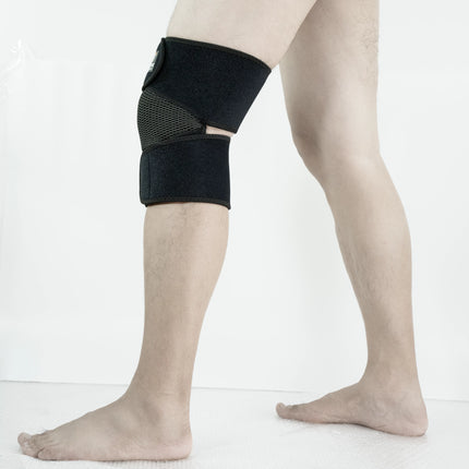 Person wearing a black knee brace on a white background